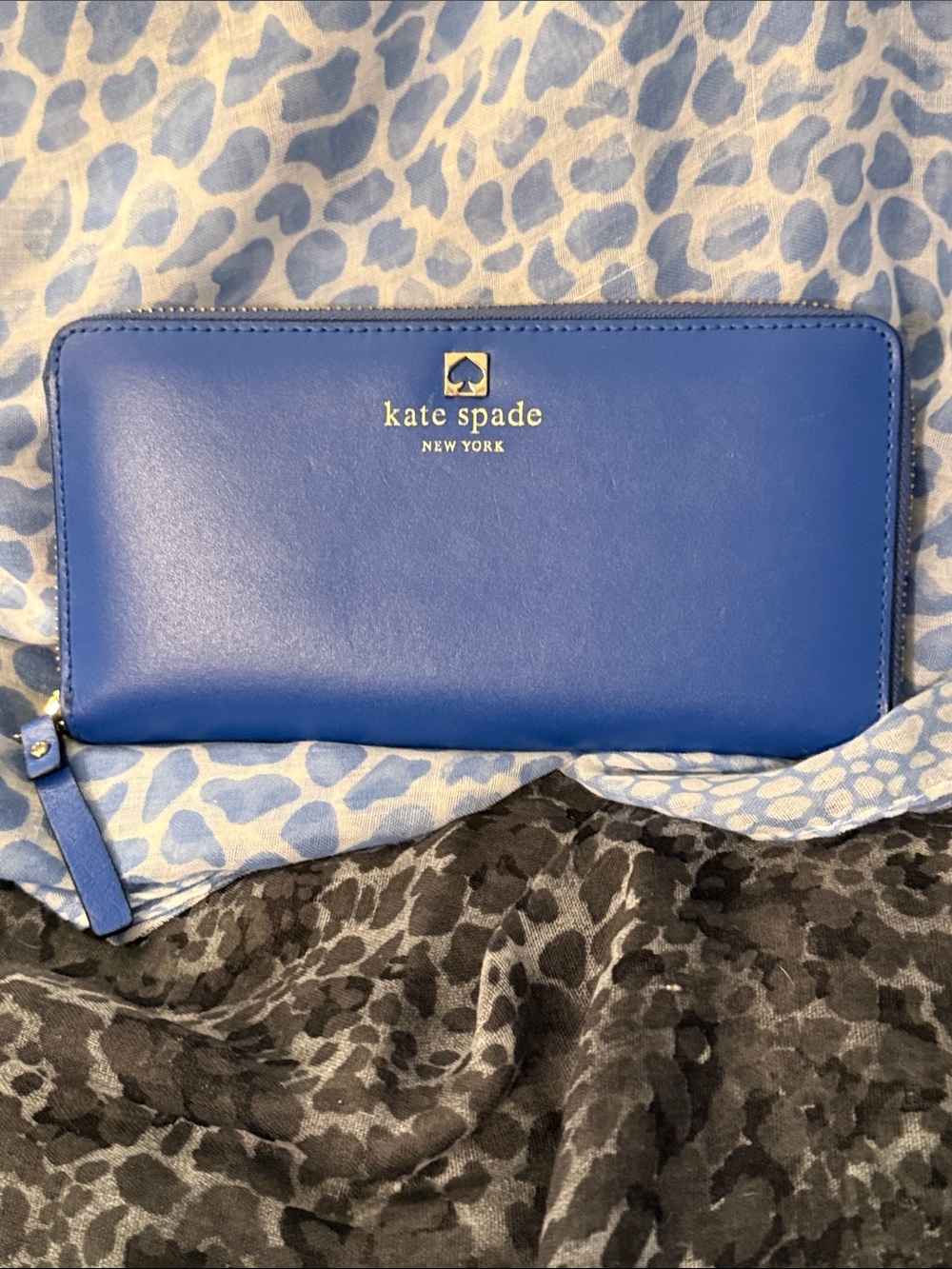 kate spade blue zip-around leather wallet with gold logo